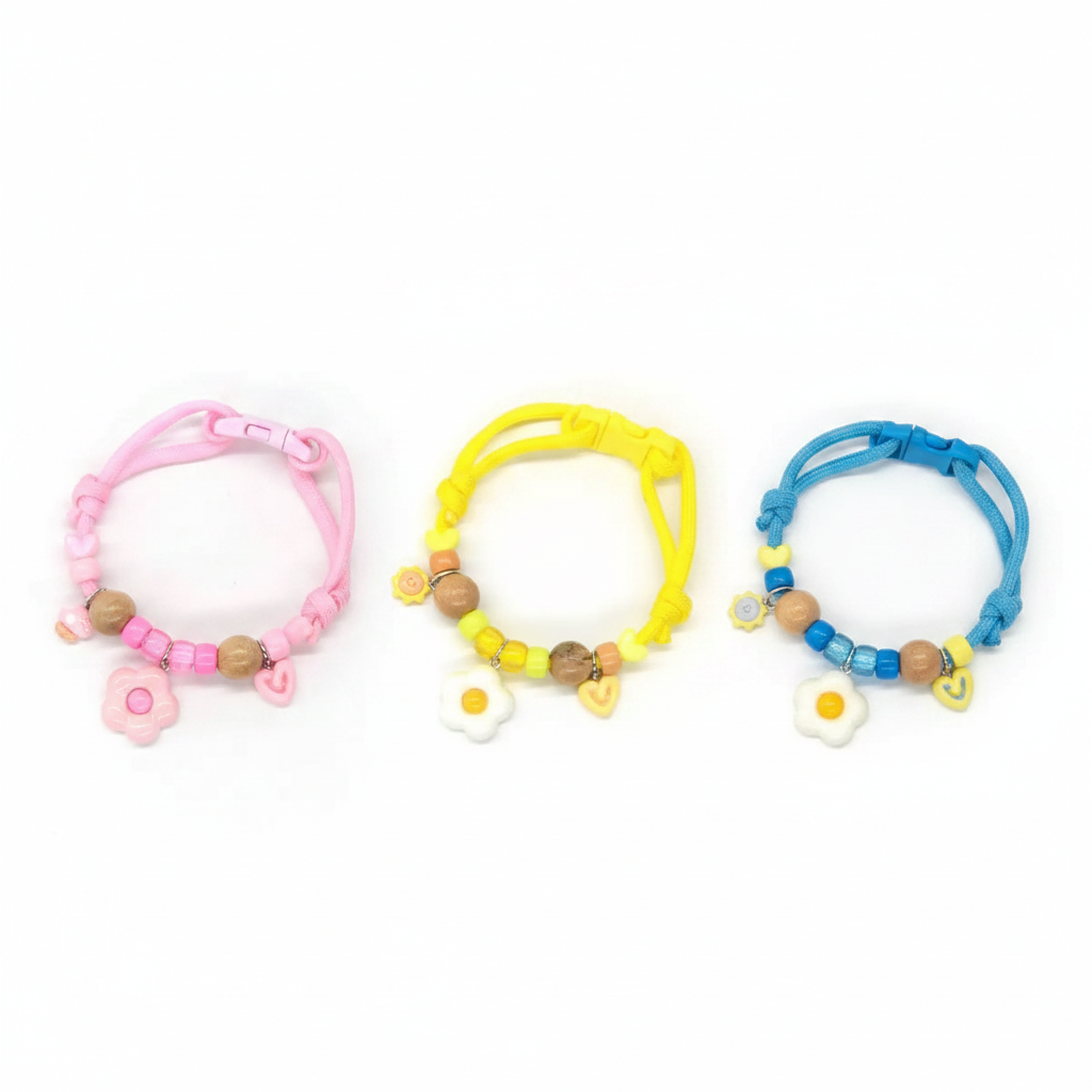 Three color camphor wood flea repellent pet collars on white background - pink yellow blue